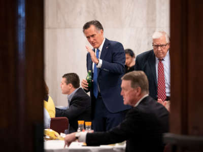 Sen. Mitt Romney speaks as he attends a Senate GOP lunch meeting in the Russell Senate Office Building on Capitol Hill, March 20, 2020, in Washington, D.C.