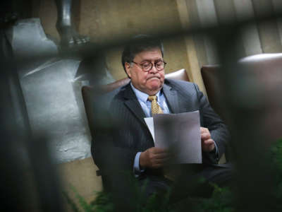 Attorney General William Barr looks over notes during an event at the U.S. Department of Justice on December 3, 2019, in Washington, D.C.