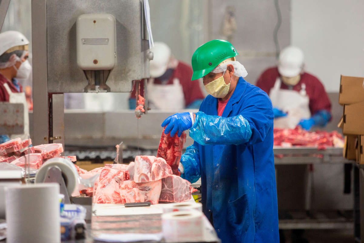 Butchers chop up beef at Jones Meat & Food Services in Rigby, Idaho