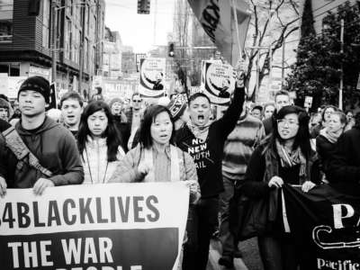 Demonstrators with #Asians4BlackLives take part in a Martin Luther King Day march on January 16, 2017, in Seattle, Washington.