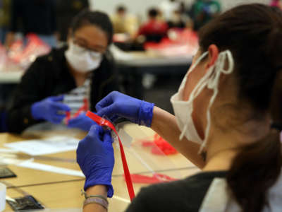 UCLA students and other volunteers make face shields to help support doctors on the frontlines of the coronavirus pandemic who may not have enough PPE at Geffen Hall UCLA on April 19, 2020, in Los Angeles, California.