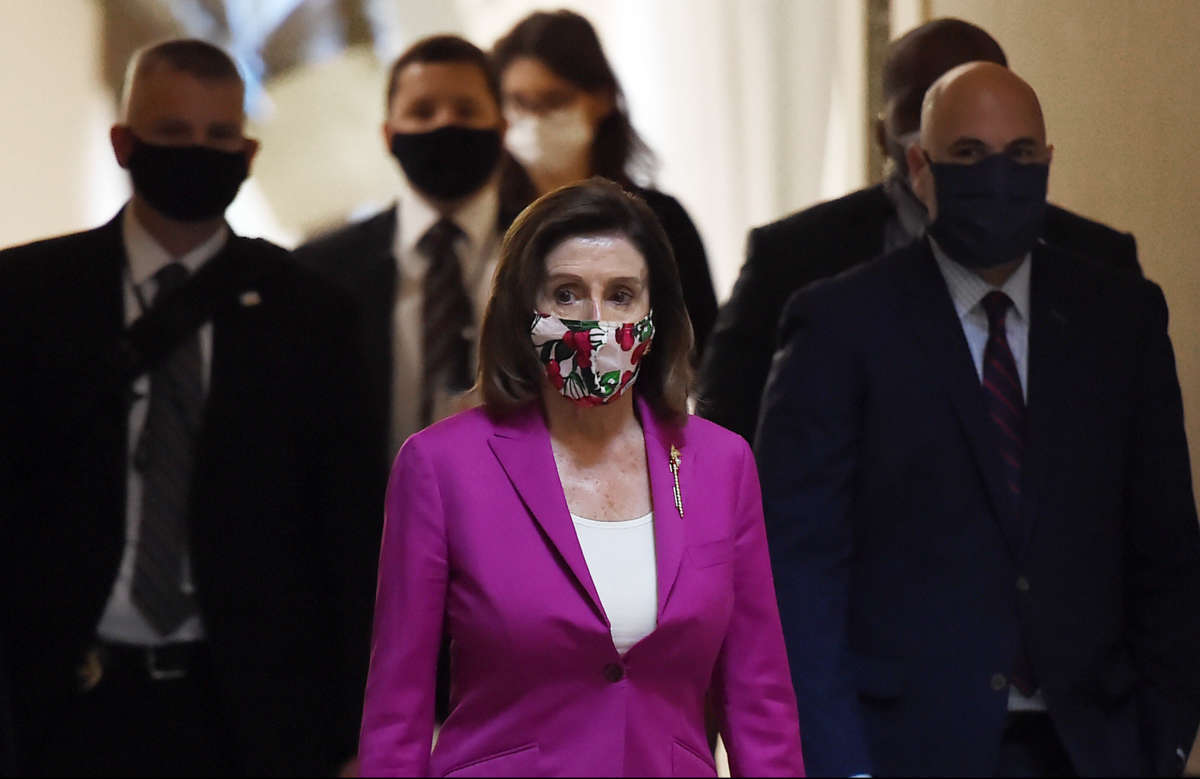 House Speaker Nancy Pelosi walks past the Statuary Hall at the U.S. Capitol on May 15, 2020, in Washington, D.C.