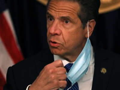 New York Gov. Andrew Cuomo arrives with a face mask at a news conference on May 21, 2020, in New York City.