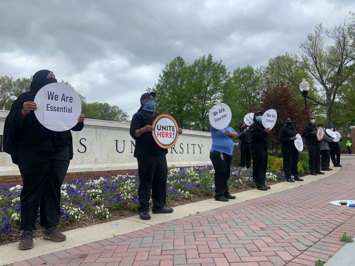 Food service workers lead a socially distanced protest at the campus of Johns Hopkins University in Baltimore, Maryland, on May 1, 2020.
