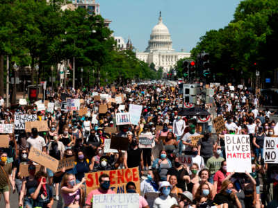 Protesters demonstrate over the death of George Floyd, by a Minneapolis police officer, at a rally on May 30, 2020, in Washington, D.C.