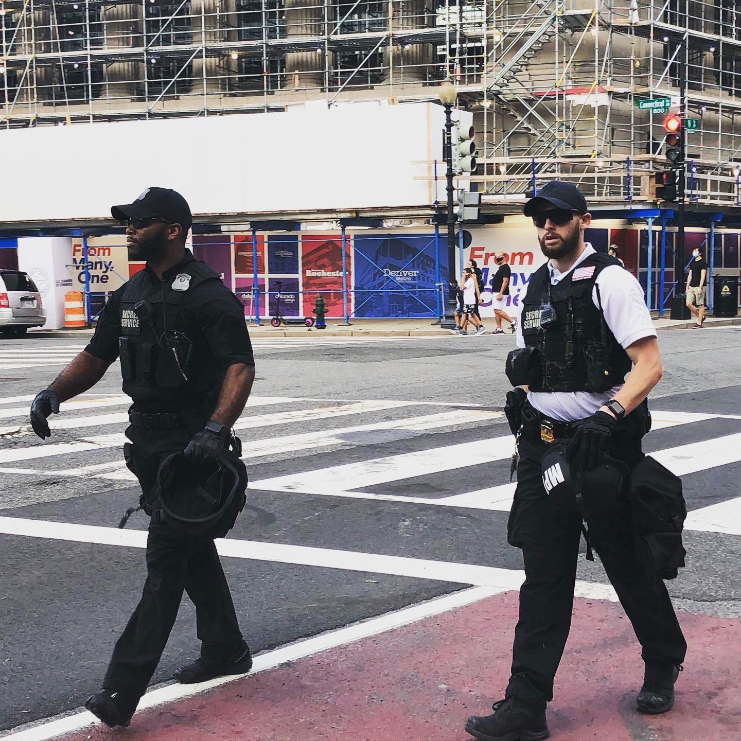 Two Secret Service agents roam the streets of Washington, D.C., on May 30.