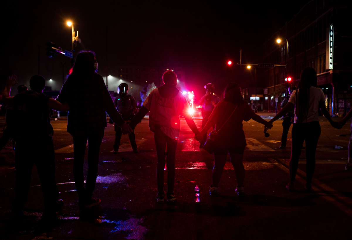 Protesters face police near the 3rd Police Precinct on May 27, 2020, in Minneapolis, Minnesota.