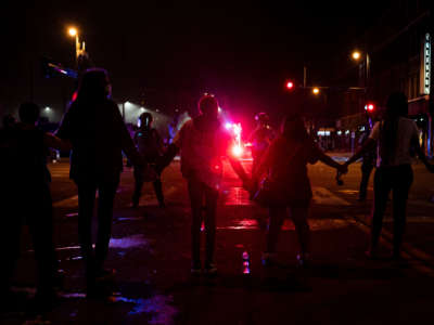 Protesters face police near the 3rd Police Precinct on May 27, 2020, in Minneapolis, Minnesota.