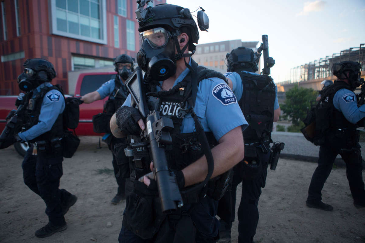 Police officers clear the area of protesters after curfew in Minneapolis, Minnesota, on May 29, 2020.