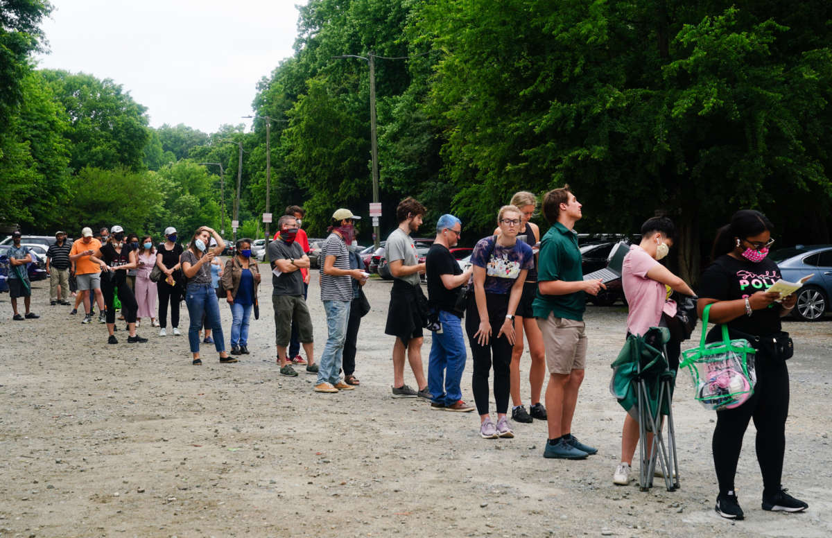 People wait in line to vote in Georgia's primary election on June 9, 2020, in Atlanta, Georgia.