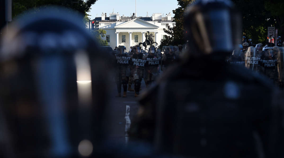 Military police members hold a perimeter near the White House as demonstrators gather to protest the killing of George Floyd on June 1, 2020, in Washington, D.C.