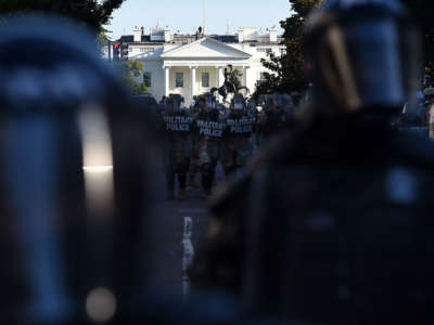 Military police members hold a perimeter near the White House as demonstrators gather to protest the killing of George Floyd on June 1, 2020, in Washington, D.C.