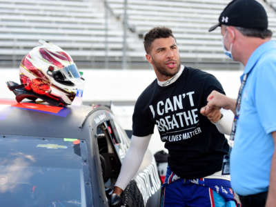 Bubba Wallace, driver of the #43 Richard Petty Motorsports Chevrolet, wears a "I Can't Breathe - Black Lives Matter" t-shirt under his fire suit on May 25 at Martinsville Speedway on June 10, 2020, in Martinsville, Virginia.