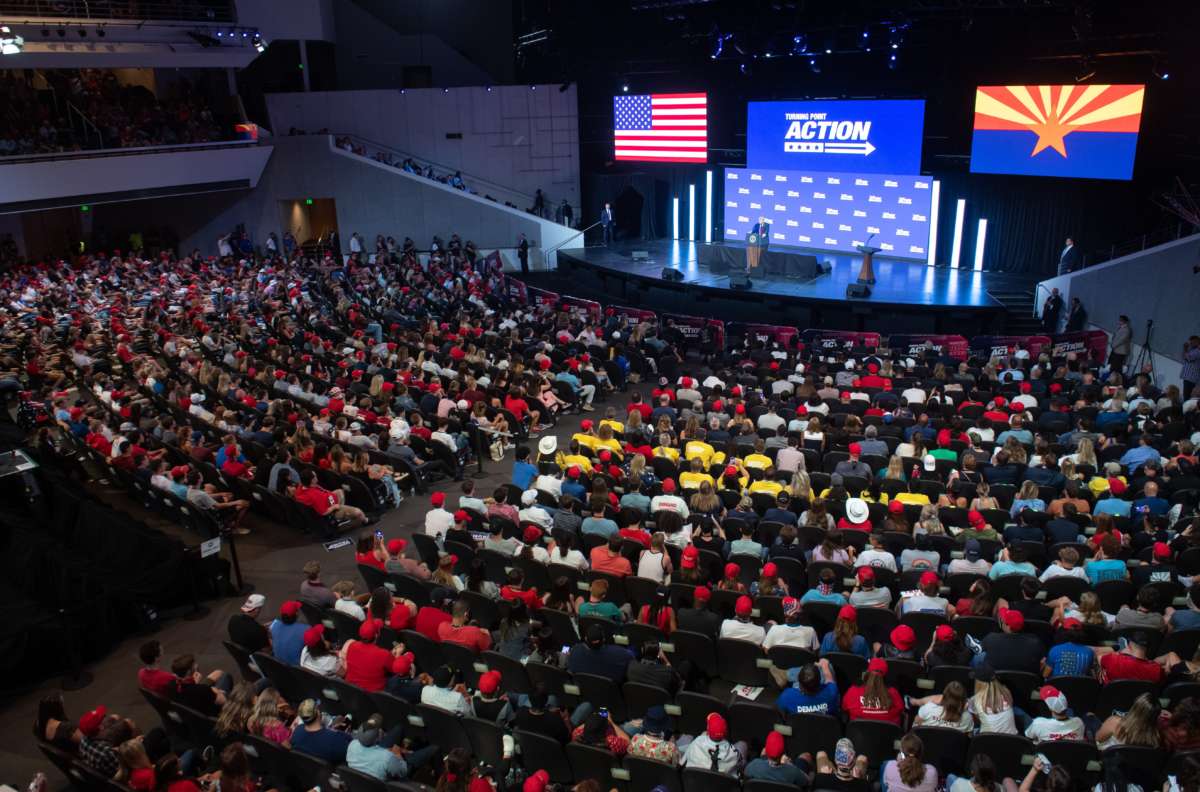 People fill the rows of a church as donald trump speaks onstage