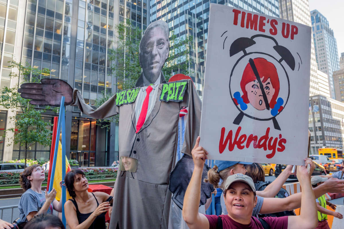 Immokalee farmworkers and their families protest outside Nelson Peltz's offices at Trian Partners in Manhattan on July 19, 2018, to demand that Wendy's, the final fast food hold-out from the Fair Food Program, make an unequivocal commitment to human rights.