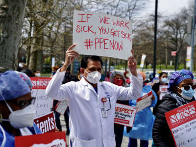 Public health workers, doctors and nurses protest over lack of sick pay and personal protective equipment outside a hospital in the borough of the Bronx on April 17, 2020, in New York City.