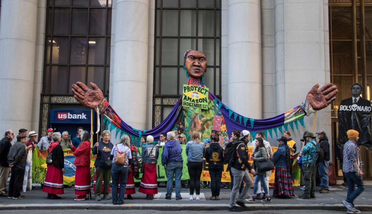 On June 21, 2019, a demonstration outside the Consulate General of Brazil in San Francisco, organized by the Brasil Solidarity Network, Idle No More SF Bay and Indigenous Women of the Americas Defending Mother Earth Treaty, featured a giant puppet, a road shutdown and a street painting to send a message to Brazilian President Jair Bolsonaro: Protect the Amazon, respect Indigenous rights, the Amazon is not for sale.