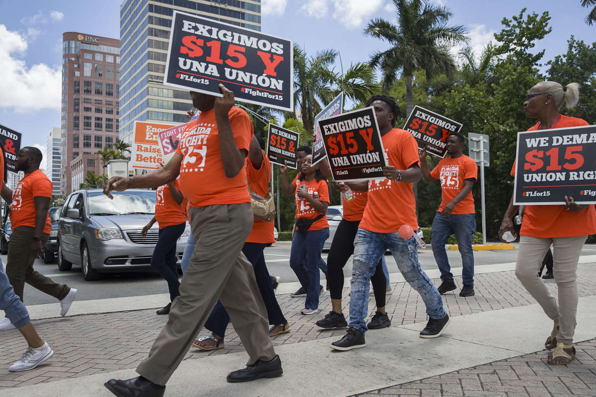 People gather together to ask the McDonald’s corporation to raise workers wages to a $15 minimum wage as well as demanding the right to a union on May 23, 2019, in Fort Lauderdale, Florida.