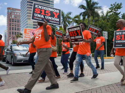 People gather together to ask the McDonald’s corporation to raise workers wages to a $15 minimum wage as well as demanding the right to a union on May 23, 2019, in Fort Lauderdale, Florida.