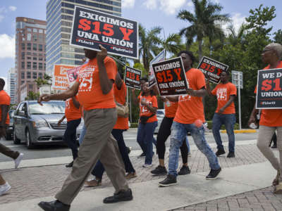 People gather together to ask the McDonald’s corporation to raise workers wages to a $15 minimum wage as well as demanding the right to a union on May 23, 2019, in Fort Lauderdale, Florida.