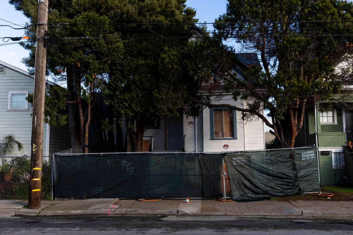 A newly-erected fence blocks the front of a vacant home that Moms 4 Housing activists occupied during a months-long protest which ended in a court ordered eviction, in Oakland, California, on January 28, 2020.