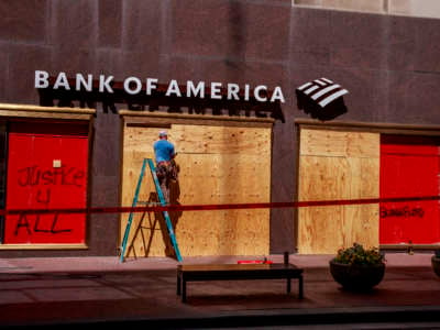 A Bank of America branch is boarded up in downtown after protests began against the police killing of George Floyd and Sean Reed in Indianapolis.