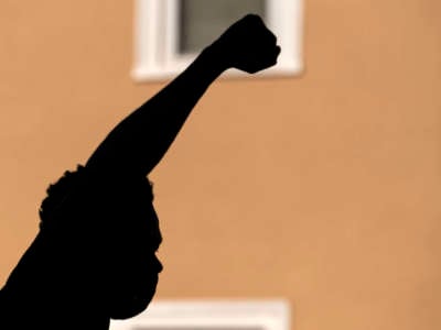 A protester holds up their fist during a demonstration outside the Minneapolis Police and Fire Union office during a rally on June 12, 2020, in Minneapolis, Minnesota.