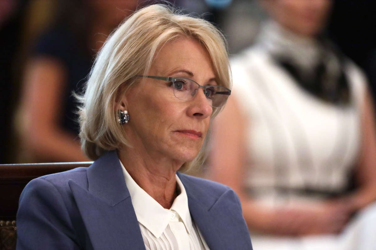 Secretary of Education Betsy DeVos listens during a cabinet meeting in the East Room of the White House on May 19, 2020, in Washington, D.C.