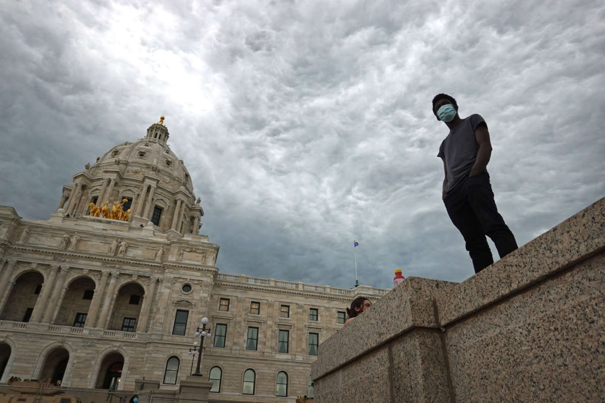 A man stands outside of the Minneapolis capital building as unrest continues around the country following the death of George Floyd on June 2, 2020, in St. Paul, Minnesota.