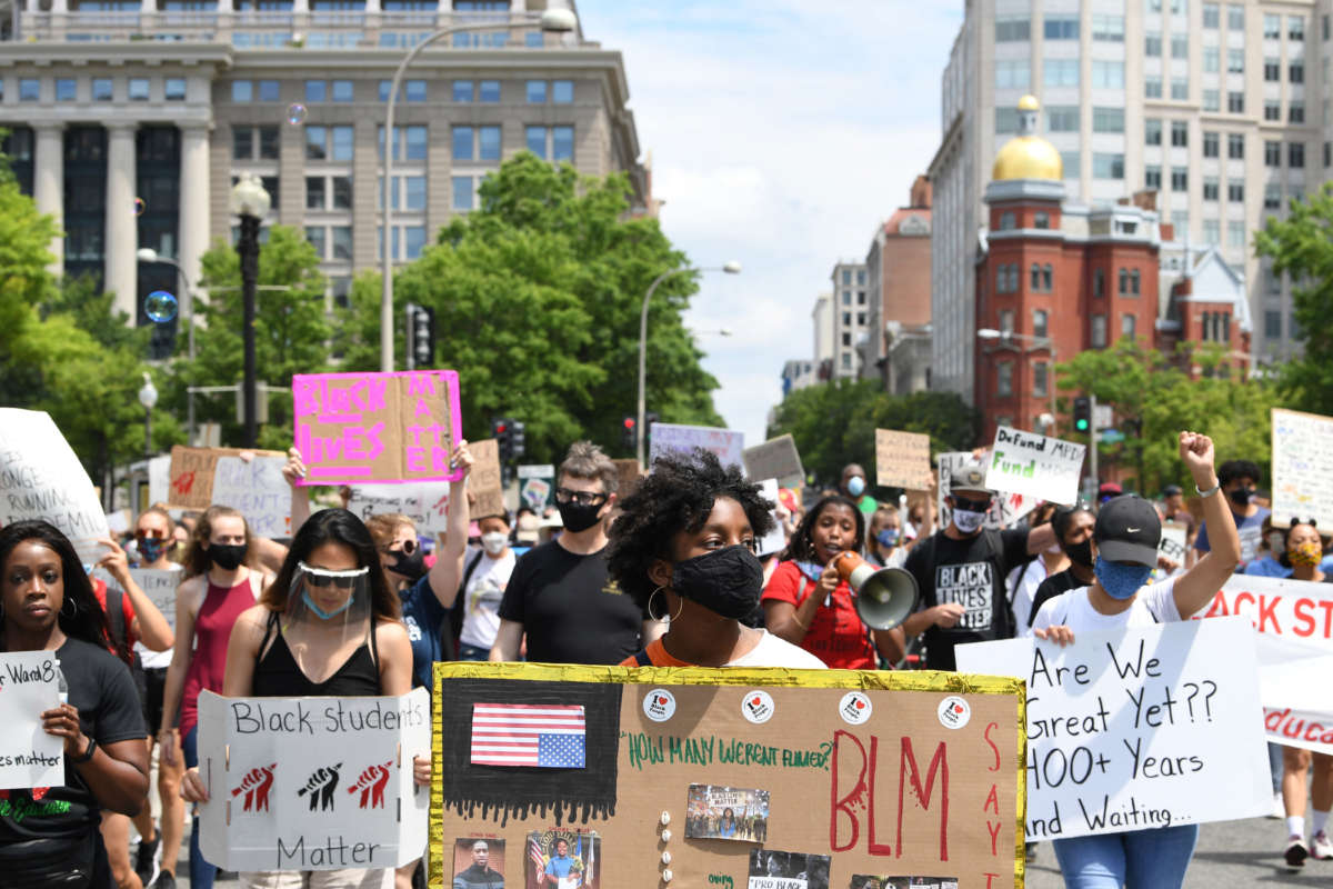 Demonstrators march towards the U.S. Department of Education for the Black Students Matter march and rally, which was organized by Educators for Equity on Friday, June 19, 2020, in Washington, D.C.