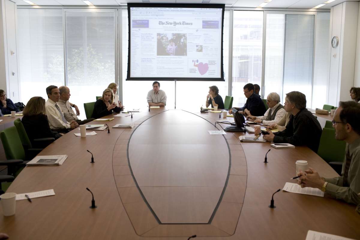 White journalists meet in the Page One conference room near the newsroom at the New York Times Building in May 2008, in New York City.