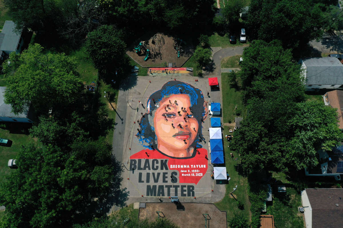 A ground mural depicting Breonna Taylor with the text 'Black Lives Matter' is seen being painted at Chambers Park on July 5, 2020 in Annapolis, Maryland.