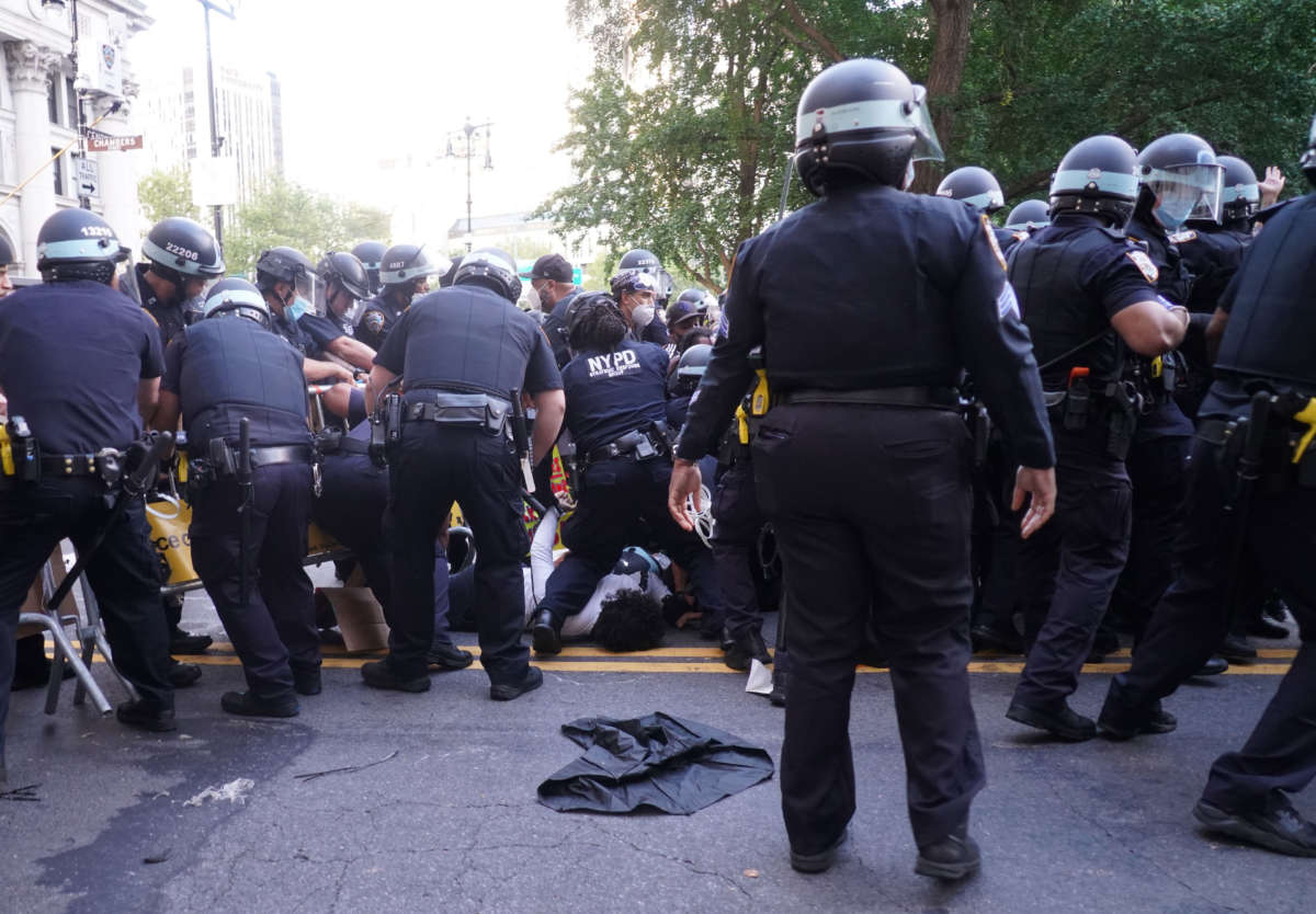 Protestors and police officers clash on July 1, 2020, in New York City.