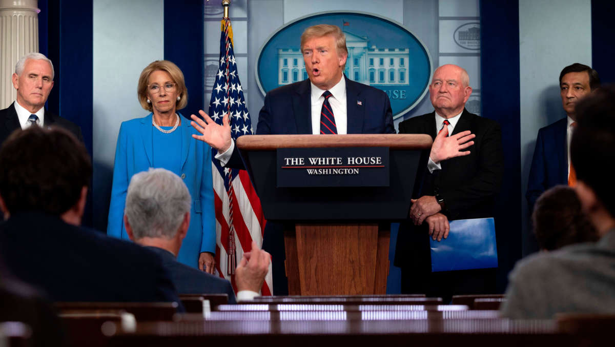 President Trump speaks, flanked by Vice President Mike Pence, Education Secretary Betsy DeVos and Agriculture Secretary Sonny Perdue, during the daily briefing on COVID-19, in the Brady Briefing Room at the White House on March 27, 2020, in Washington, D.C.