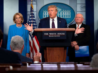 President Trump speaks, flanked by Vice President Mike Pence, Education Secretary Betsy DeVos and Agriculture Secretary Sonny Perdue, during the daily briefing on COVID-19, in the Brady Briefing Room at the White House on March 27, 2020, in Washington, D.C.