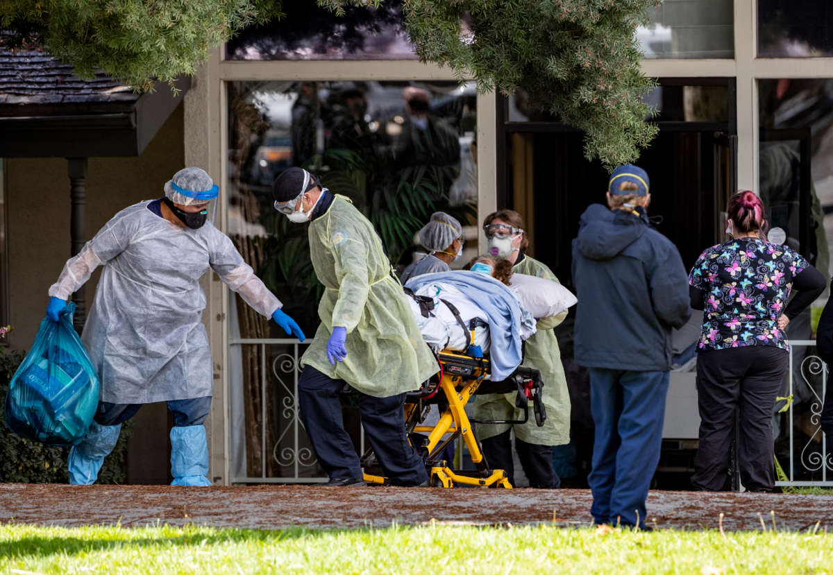 Patients are removed from Magnolia Rehabilitation and Nursing Center after 39 tested positive for coronavirus on April 8, 2020, in Riverside, California.