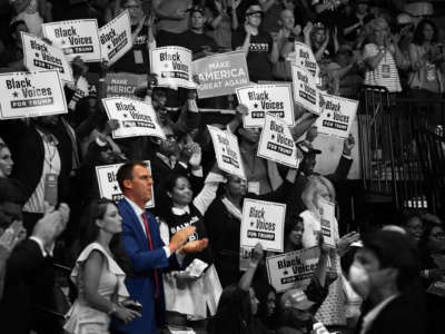 Gov. Kevin Stitt claps as President Trump speaks during a campaign rally at the Bank of Oklahoma Center on June 20, 2020, in Tulsa, Oklahoma.