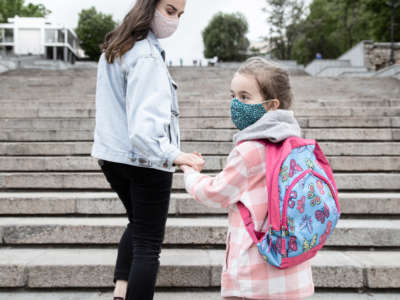 Parent and child with facemasks