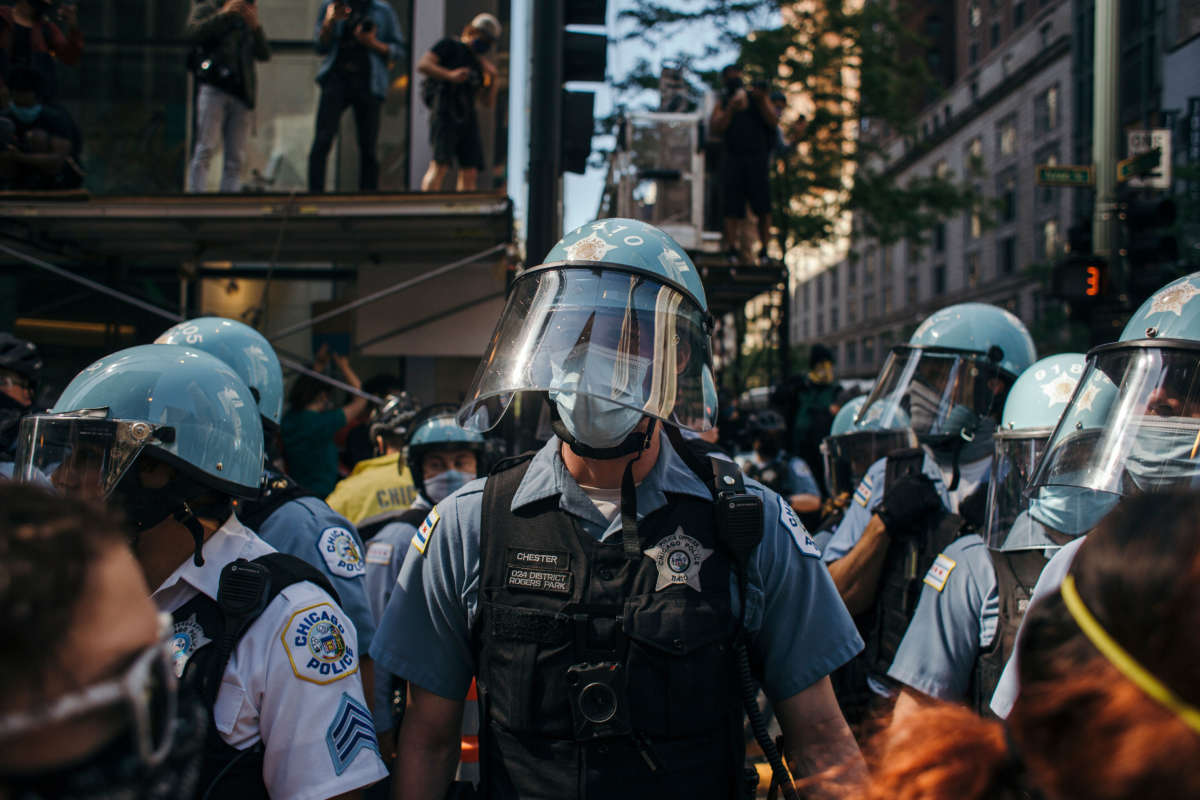 Police officers block protesters from joining together at various check points in Chicago, on May 30, 2020, during a protest against the death of George Floyd.