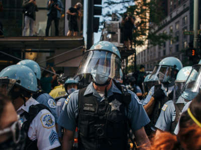 Police officers block protesters from joining together at various check points in Chicago, on May 30, 2020, during a protest against the death of George Floyd.