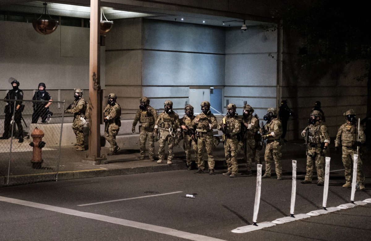 Federal officers prepare to disperse a crowd of protestors outside the Multnomah County Justice Center on July 17, 2020, in Portland, Oregon.