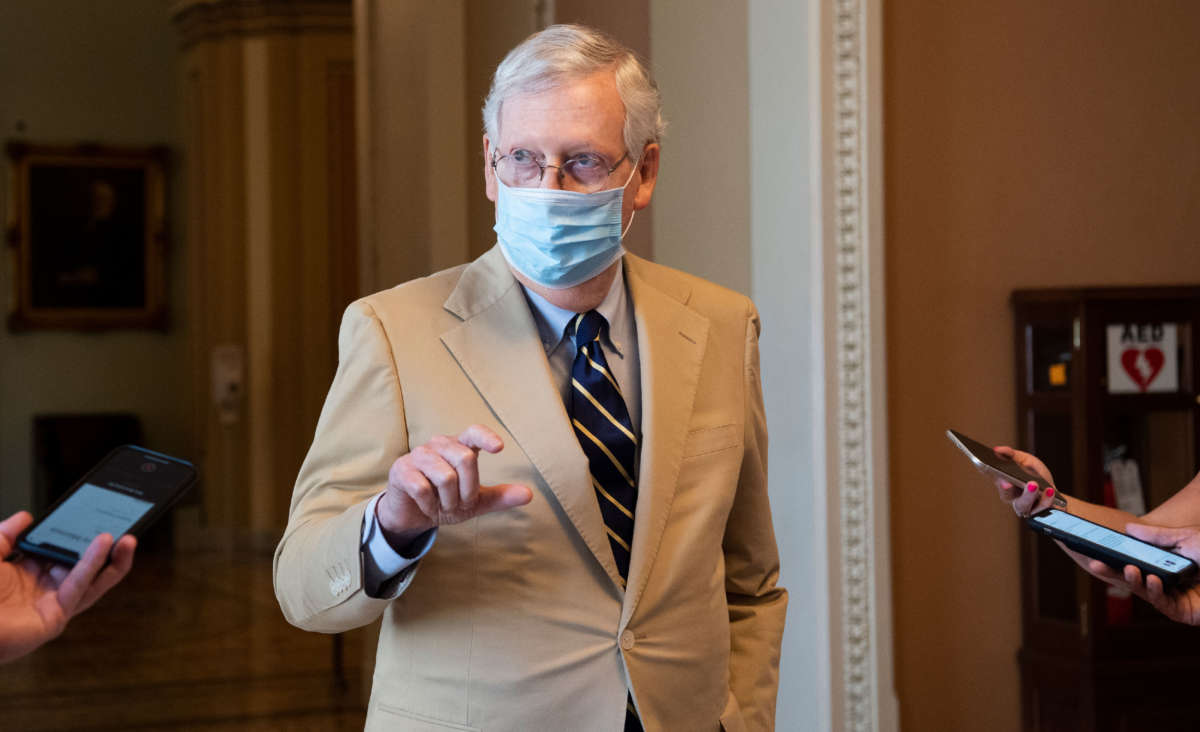 Senate Majority Leader Mitch McConnell talks with reporters as he departs from the Senate floor in the Capitol in Washington on July 20, 2020.