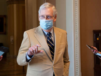 Senate Majority Leader Mitch McConnell talks with reporters as he departs from the Senate floor in the Capitol in Washington on July 20, 2020.