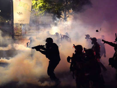 Federal officers deploy tear gas and less-lethal munitions while dispersing a crowd of about a thousand protesters in front of the Mark O. Hatfield U.S. Courthouse on July 24, 2020, in Portland, Oregon.