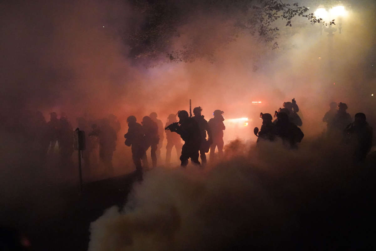 Federal officers deploy tear gas and less-lethal munitions while dispersing a crowd of about a thousand protesters in front of the Mark O. Hatfield U.S. Courthouse on July 24, 2020, in Portland, Oregon.