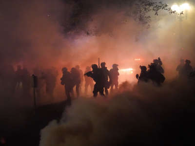 Federal officers deploy tear gas and less-lethal munitions while dispersing a crowd of about a thousand protesters in front of the Mark O. Hatfield U.S. Courthouse on July 24, 2020, in Portland, Oregon.