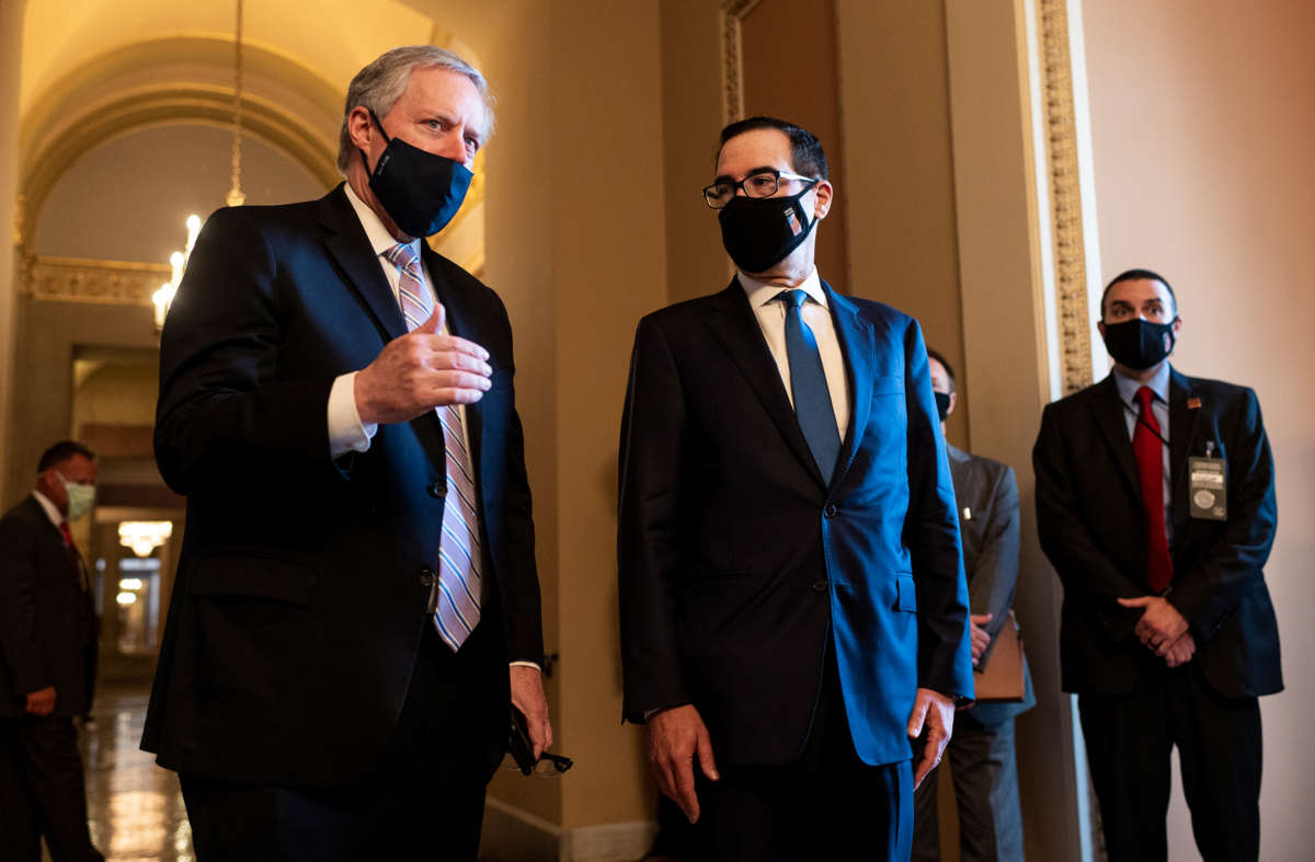 Steve Mnuchin, correctly wearing his mask, stands beside Mark Meadows, who is very incorrectly wearing his mask