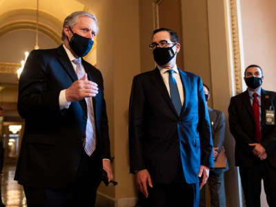 Steve Mnuchin, correctly wearing his mask, stands beside Mark Meadows, who is very incorrectly wearing his mask