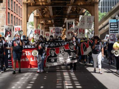 Fast food workers and supporters march during a national workers strike in the Loop in Chicago, Illinois, on July 20, 2020.