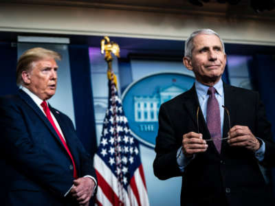 President Trump listens as Dr. Anthony Fauci, director of the National Institute of Allergy and Infectious Diseases, speaks with members of the coronavirus task force during a briefing in the James S. Brady Press Briefing Room at the White House on April 22, 2020, in Washington, D.C.